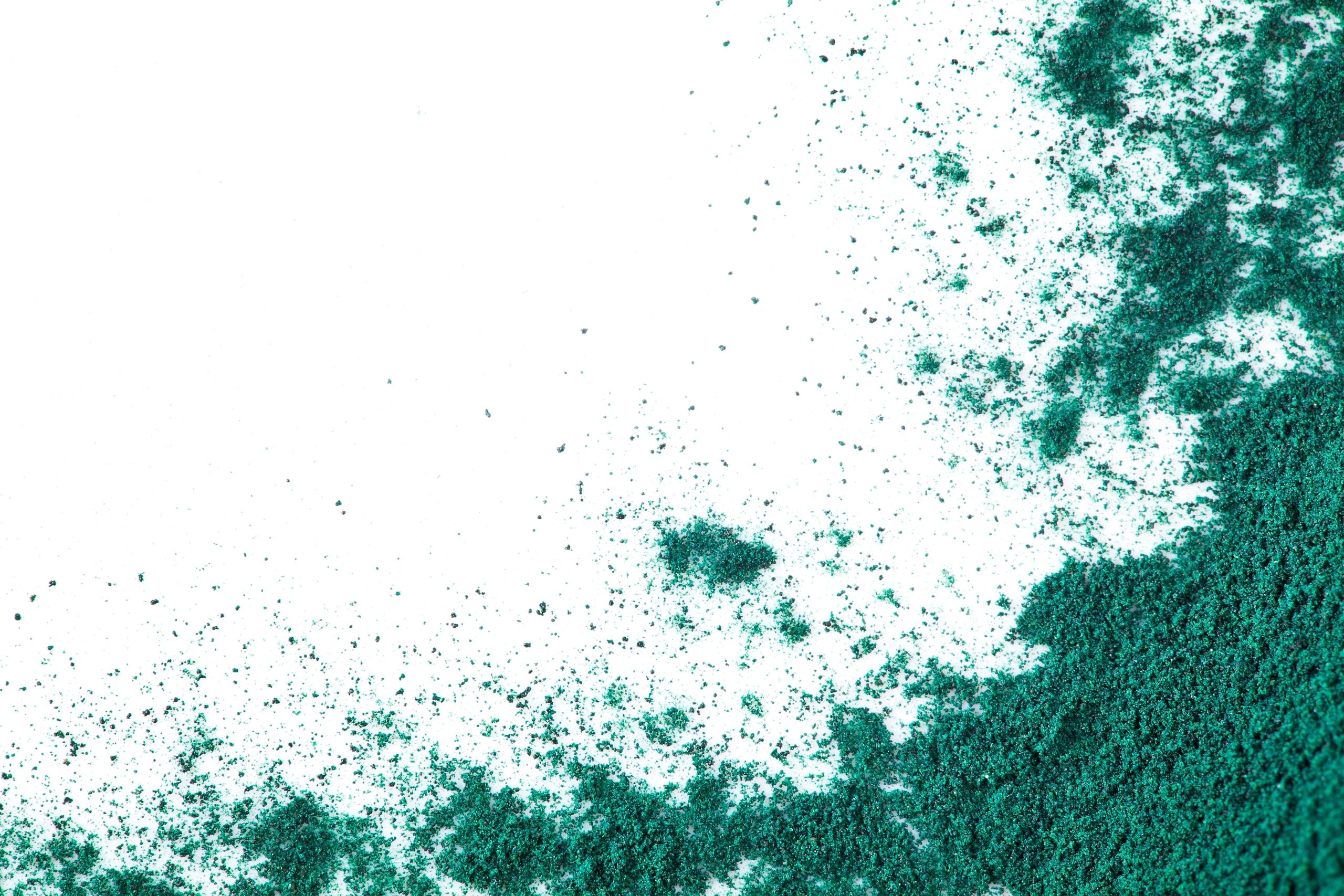 Spirulina powder close-up representing plant-based extract science